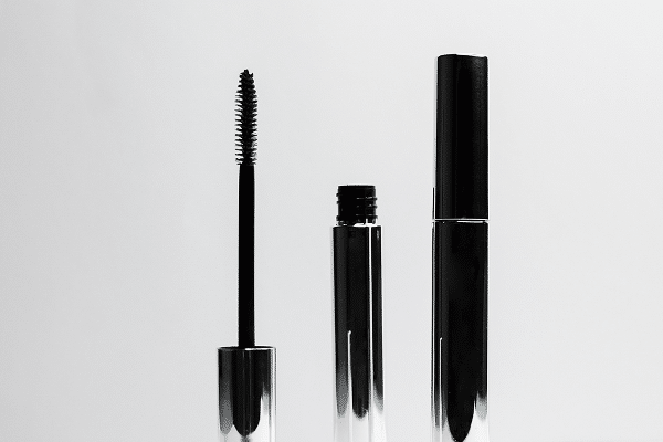 A black mascara in a shiny silver pack + fiber brush