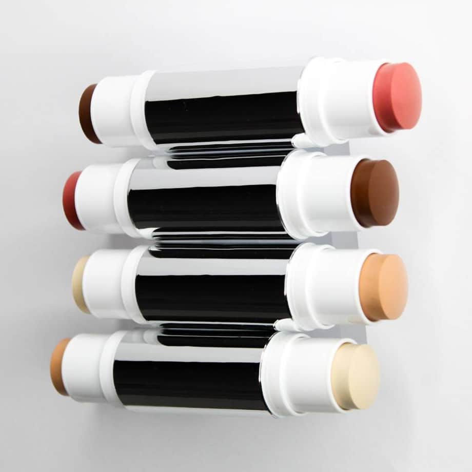 Four silver dual-ended sticks: dark or light foundation with pink blush or ivory