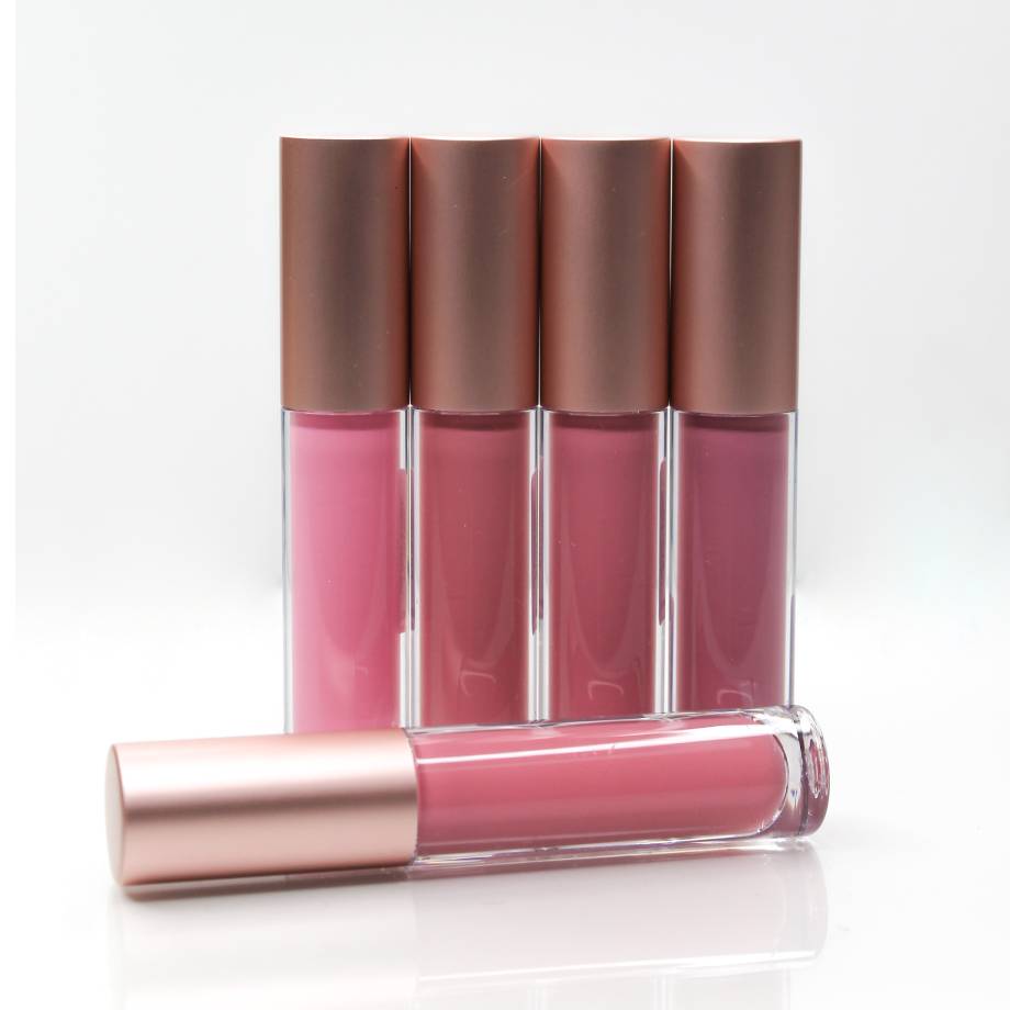 Set of pink lip glosses in clear tubes with metallic caps.