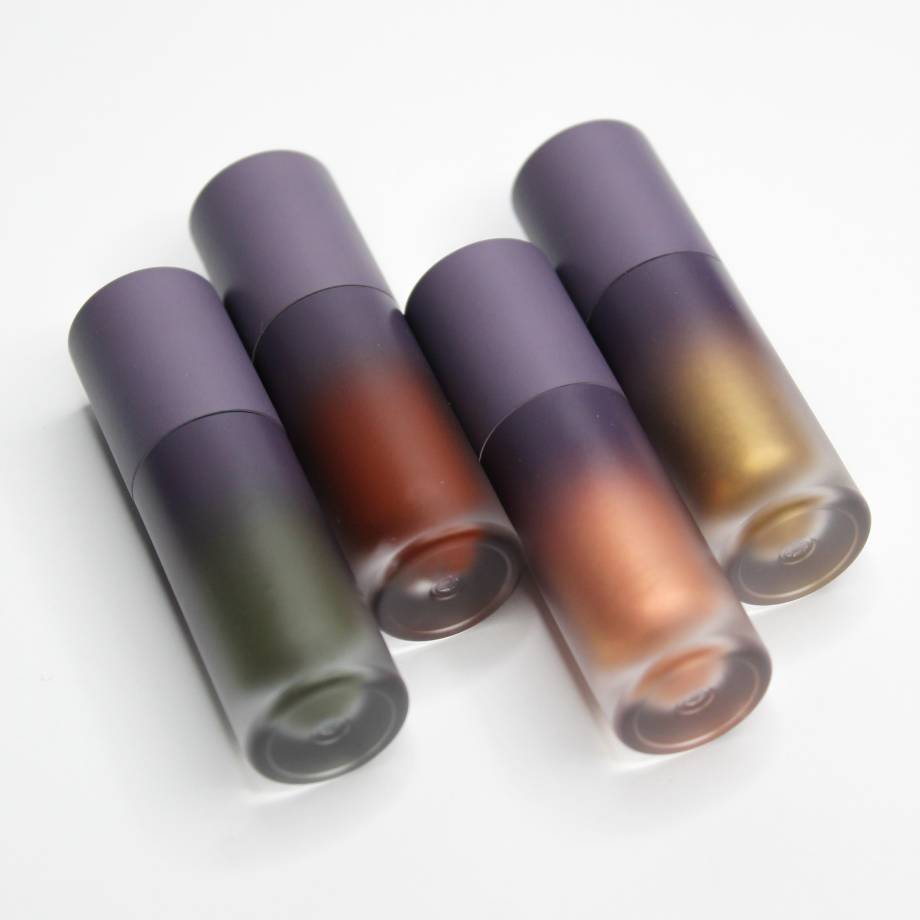Set of gradient lipstick tubes with green, brown, bronze, and gold shades.