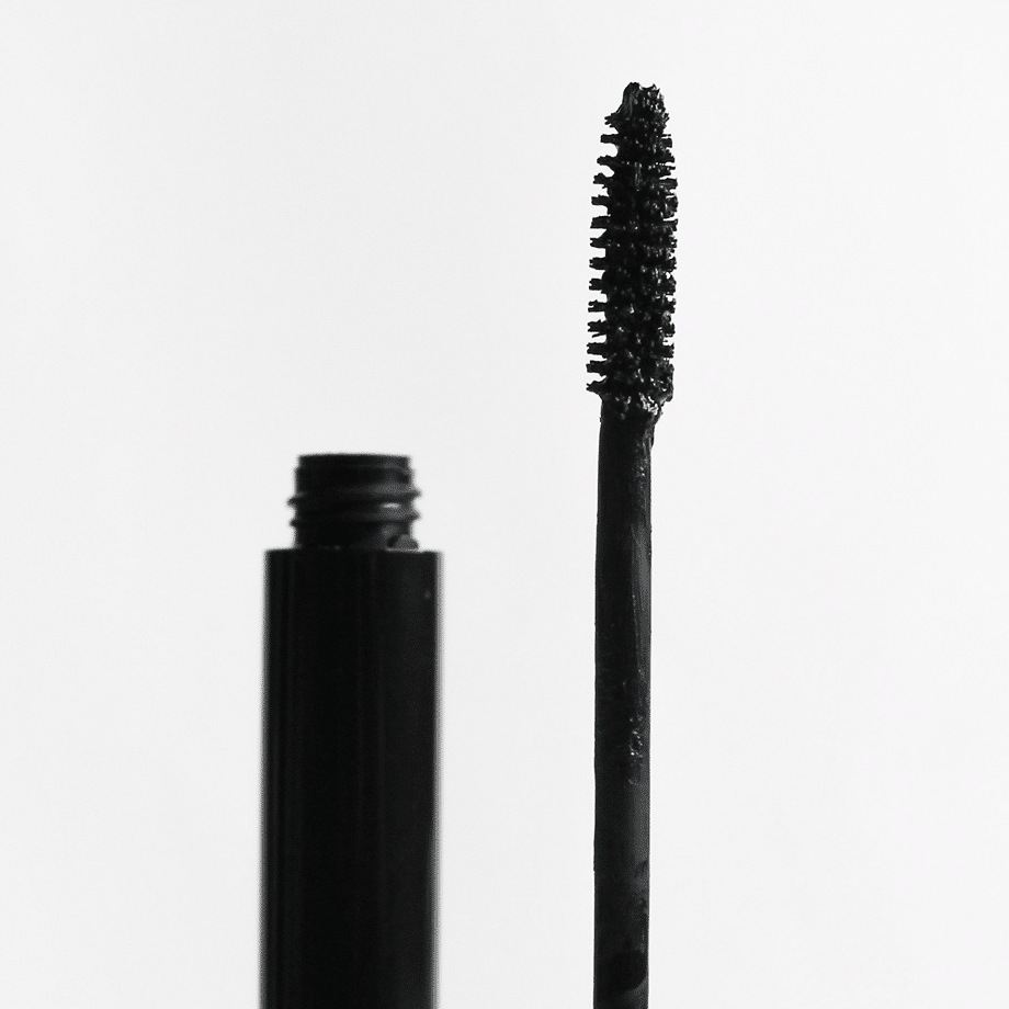 Deep Frequency bottle and brush in black packaging on a white background