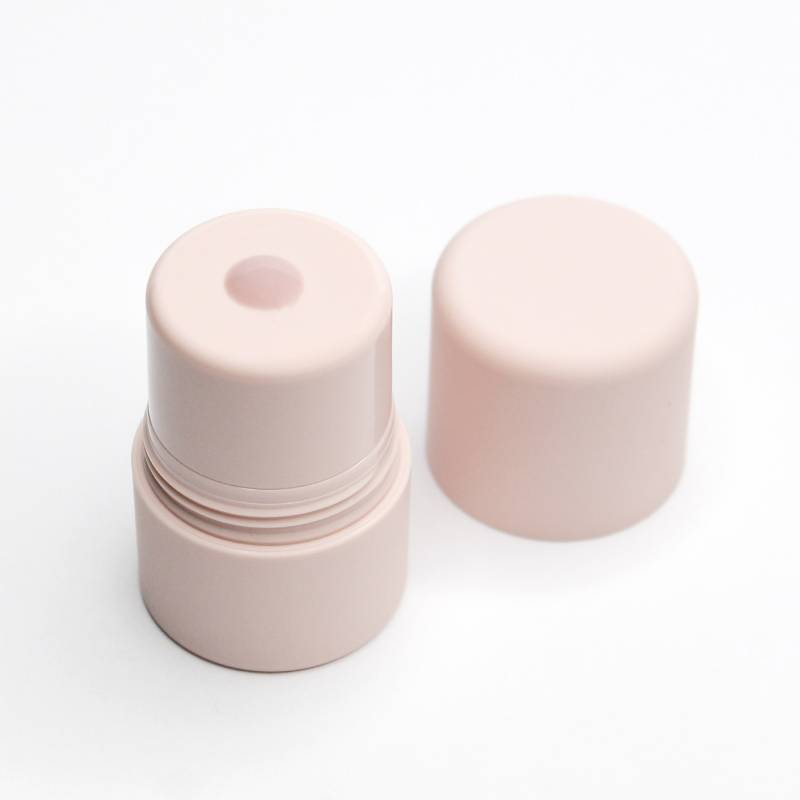 Light pink liquid face primer in airless bottle with cap