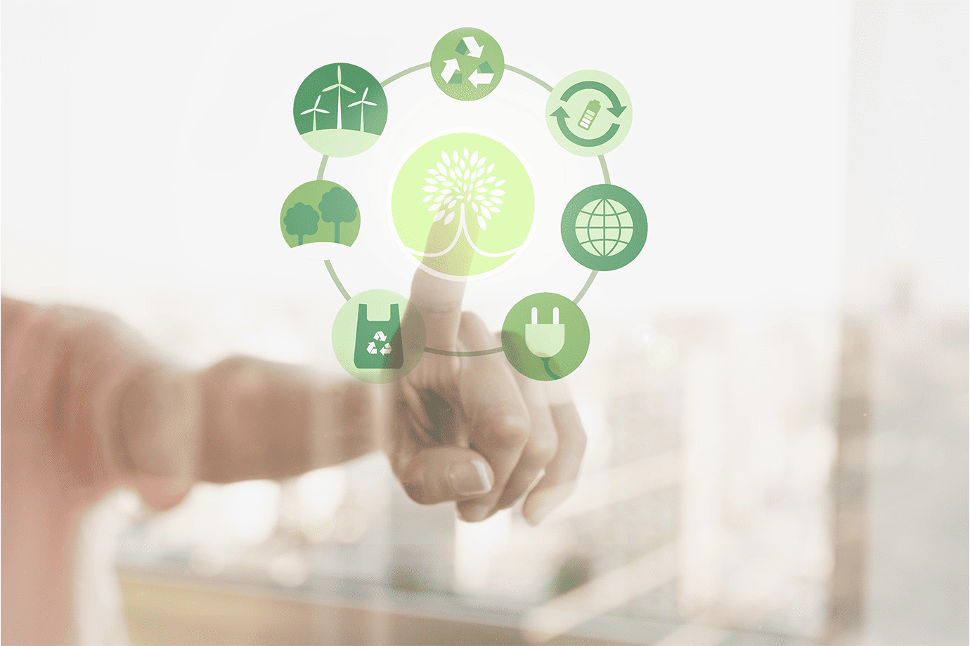 Hand touching eco-friendly sustainability icons in a circular interface