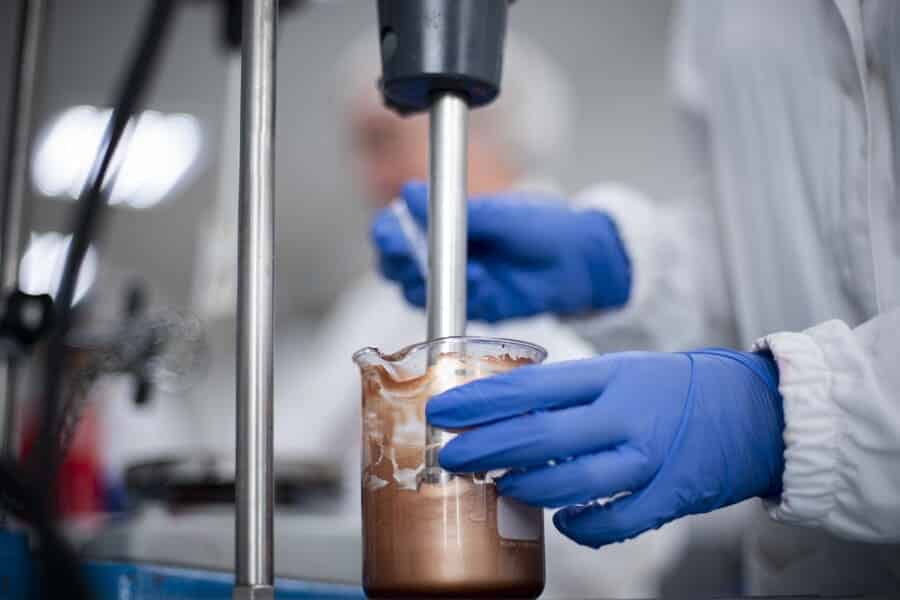 Cosmetic formulation mixed in a beaker during makeup product development